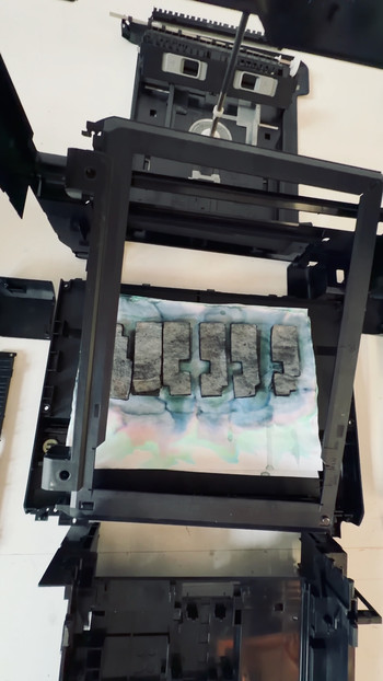 Self-portrait composed of inkjet printer components